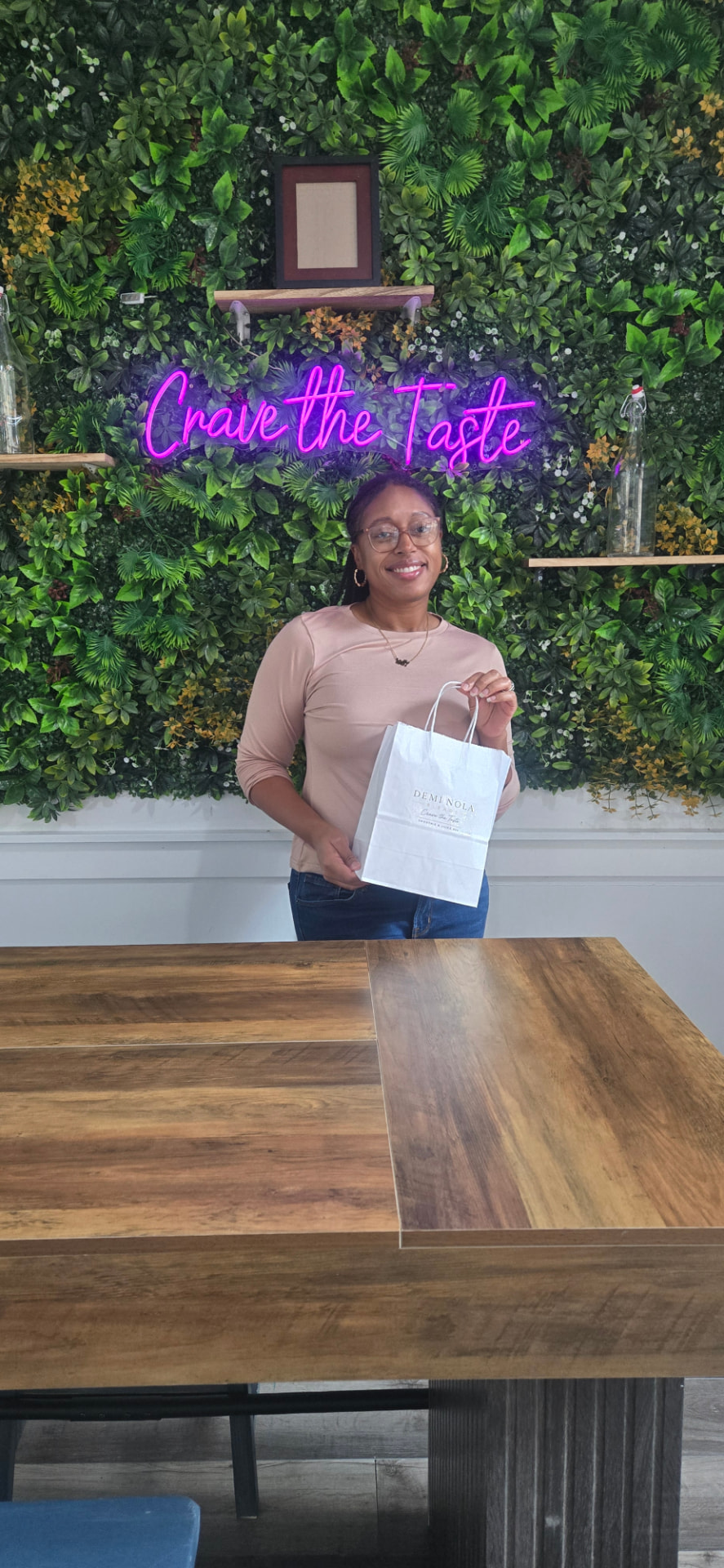Demi Nola Blends counter with the Crave the Taste wall